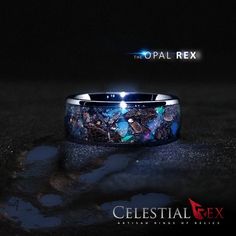 Tyrannosaurus Rex Dinosaur Bone Fossil, Nantan Meteorite, & Real Ethiopian Fire Opal Blue Glow Ring This ring's glow can be customized. THE MATERIALS IN THIS RING ARE 100% REAL AND GUARANTEED AUTHENTIC TYRANNOSAURUS REX BONE FOSSIL AND NANTAN METEORITE FRAGMENTS RING INFORMATION Ring Name: Opal Rex™ Inlay: T-Rex, Nantan Meteorite, Ethiopian Fire Opal Day/Glow: Blue Sleeve: Tungsten Profile: Dome Finish: Polished Fit: Comfort Fit ADDITIONAL INFORMATION: This item is a handmade ring and crafte Lunar Meteorite, Glow Ring, Tooth Ring, Ring Name, Fossil Bones, Blue Glow, Meteorite Ring, Dinosaur Bones, Custom Wedding Rings