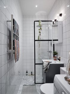 the bathroom is decorated in white and black