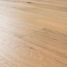 a close up view of an unfinished wood floor