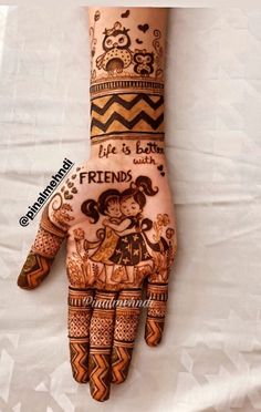 a henna that is on someone's hand with the words life is better and friends