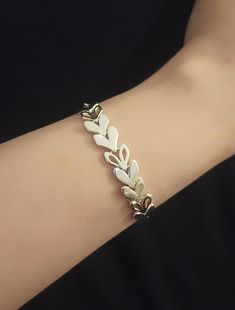 "fancy handmade Leaf Wheat Ear Bracelet is made by Hand and Love. design is a Wheat handmade Chain Bracelet and the metal is sterling silver.  bracelet Diameters: 16-18cm(adjustable) Material: High-Quality Solid 925 Sterling Silver Style: Minimalism - see my handmade textured jewelry design:  https://etsy.me/3sfFkrJ - see the video of this bangle bracelet: https://youtu.be/IQsC9rSc_L0 So sweet and adorable bangle bracelet, you would want to wear it every day! All my items come in a box, perfect for gift giving.  Giving a gift? I can include a note no problem, please leave the message at checkout. RETURNS AND EXCHANGES TERMS ♥ SHOP WITH CONFIDENCE ♥ This piece is made by hand and love. We gladly accept returns and exchanges within 14 days of delivery. Enjoy your shopping :) If you have any Handmade Bangle Bracelets, Ear Chain, Bridal Pearl Necklace, Handmade Chain, Minimal Necklace, Handmade Bangles, Gold Gift, Birthday Jewelry Gift, Silver Style