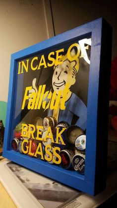 there is a blue framed sign that says in case of fail break glass on it