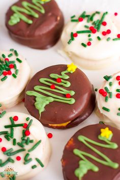 decorated cookies are arranged on a white plate