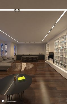 a living room filled with furniture and bookshelves next to a wooden flooring