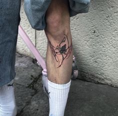 a person with a tattoo on their leg