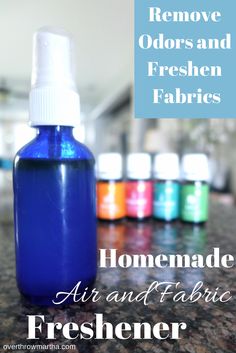 a bottle of homemade air and fabric freshener sitting on a counter top with the words remove odors and freshen fabrics