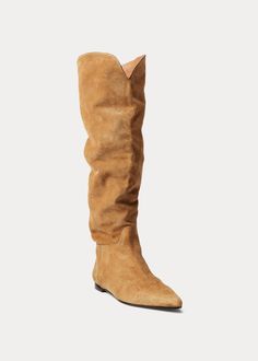 TALL SLOUCHY BOOT | 818908752001 0.25" (10 mm) heel height. 15" (38.5 cm) shaft height. 14" (36 cm) shaft opening circumference. Pointed toe. Slip-on styling. Western-inspired shaft opening. Signature debossed Pony at the outer heel. Padded leather insole. Buffed leather outsole. Includes our “Polo Ralph Lauren”–printed box and a dust bag. Upper, lining, and outsole: leather. Made in Spain. Italian leather. Indulge in the luxurious allure of our expertly crafted knee-high suede boot, handmade wi Suede Flat Boots, Boot For Women, Knee High Boots Flat, Slouchy Boots, Women Ralph Lauren, Suede Boots Knee High, Shopping Event, Flat Boots, Flat Sneakers