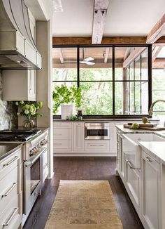 the kitchen is clean and ready for us to use it's natural wood flooring