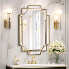 a bathroom with marble counter tops and gold accents on the wall, along with a large mirror