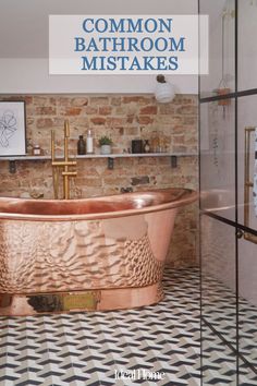 a bathroom with a large copper bath tub