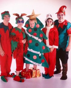 a group of people dressed up in christmas costumes