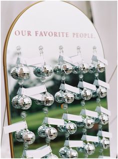 a mirror that has some silver balls on it and the words our favorite people written on it