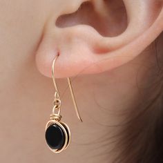 There is nothing ordinary about this wrap earrings. Set with a beautiful Black Onyx that goes well with any outfit. Most recommended as a set with our black onyx ring and necklace :) Necklace here: https://www.etsy.com/il-en/listing/949968751/black-onyx-knot-necklace-handmade?ga_search_query=black%2Bonyx&ref=shop_items_search_2&pro=1&frs=1 Ring here: https://www.etsy.com/il-en/listing/768189894/black-onyx-knot-ring-handmade-ring-onyx?ga_search_query=black%2Bonyx&ref=shop_items_se Elegant Onyx Wire Wrapped Jewelry, Black Wire Wrapped Drop Earrings, Dainty Black Nickel-free Earrings, Black Dainty Earrings, Wrap Earrings, Earrings Wire, Wrapped Earrings, Onyx Earrings, Knot Earrings