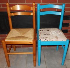 two wooden chairs sitting next to each other in front of a brick wall and floor