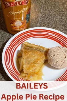 an apple pie is on a plate next to a jar of maple syrup and ice cream