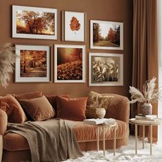 a living room filled with furniture and pictures on the wall