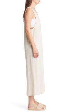 Keep it easy and breezy in this lightweight linen-kissed jumpsuit styled with handy pockets and cropped wide legs. 53" length; 21" inseam; 34" leg opening (size Medium) V-neck Sleeveless Unlined 80% rayon, 20% linen Machine wash, line dry Imported Beige Linen Summer Jumpsuits And Rompers, Summer Linen Jumpsuits And Rompers For A Day Out, Sleeveless Linen Jumpsuits And Rompers For Day Out, Sleeveless Linen Jumpsuits For Day Out, Chic Beige Linen Jumpsuits And Rompers, Sleeveless Relaxed Jumpsuits And Rompers For Spring, Relaxed Sleeveless Jumpsuits And Rompers For Spring, Relaxed Sleeveless Jumpsuits For Spring, Neutral Summer Jumpsuits And Rompers With Pockets