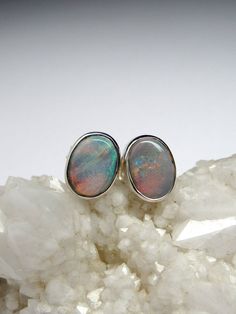 Sterling silver stud earrings with natural Black Opal opal origin - Australia weight of the earrings - 1.4 grams stone measurements: 0.24 x 0.31 in / 6 х 8 mm ref No 2461 Worldwide shipping from Berlin, Germany. Prices include all taxes, valid in Germany and in European Union countries on the Customer's order date. Price does not include import taxes and custom duties. It is the Customer's full liability to pay any possible customs duties, import taxes or other applicable and due by the concerne Sterling Silver Cabochon Earrings Gift, Unique Oval Earrings For Gift, Handmade Oval Cabochon Earrings For Gift, Oval Earrings For Gift, Opal Cabochon Jewelry Gift, Opal Cabochon Jewelry For Gift, Sterling Silver Oval Cabochon Earrings Gift, Opal Gemstone Earrings For Anniversary, Teacher Gift Ideas