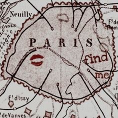 an old map shows the location of paris and its surrounding area, with red lipstick on it