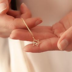 "Star of David pendant necklace in 14k or 18k SOLID Gold, Dainty Magen David Diamond Pendant, Jewish Star Necklace Gold Religious Gift For Her For Him Material: Solid Gold (real gold, not gold plated or gold filled material) Available Gold Karat: 14K (585), and 18K (750)  Pendant Width:  1.20 cm Pendant Height:  1.50 cm Available Gold Colors: Yellow gold, rose gold and white gold (optional) Available chain thickness: 0.84mm (type #2), 0.95mm (type #3) Diamond weight: 0.01 ct  Diamond color: G-H Dainty Star Of David Jewelry For Anniversary, Yellow Gold Star Of David Charm Necklace Gift, Yellow Gold Star Of David Charm Necklace, Star Of David Tarnish Resistant Necklace Gift, 14k Gold Star Of David Necklace For Anniversary, Gold Star Of David Necklace With Birthstone, Symbolic Star Of David Necklace For Gift, 14k Gold Star Of David Jewelry Gift, 14k Gold Star Of David Necklace Gift