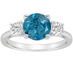 Make a statement with this gleaming ring flaunting an array of topaz gems that turn heads with every gesture. From Affinity Gems. 3 Stone Rings, Three Stone Rings, London Blue Topaz, London Blue, White Topaz, Three Stone, Promise Rings, Stone Rings, Blue Topaz