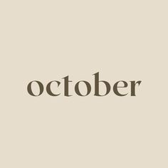 the word october written in brown on a beige background