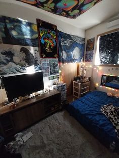 the bedroom is decorated with posters and lights