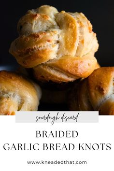 braided garlic bread knots stacked on top of each other