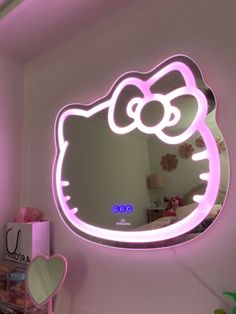 a hello kitty light up mirror on the wall