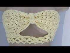 a crocheted bow tie on top of a mannequin