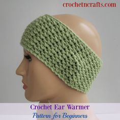 a crochet ear warmer is on top of a mannequin headband