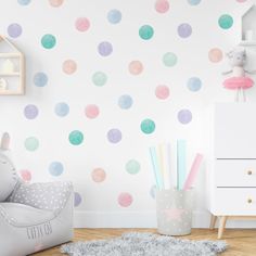 a child's room with polka dot wallpaper