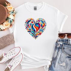 Embrace the beauty of nature and love with our Floral Heart Harmony T-Shirt! This enchanting design features a heart-shaped arrangement of vibrant, colorful flowers, symbolizing the perfect blend of affection and the natural world. Each petal and leaf is intricately detailed, creating a stunning visual that's sure to turn heads. Made from premium, soft cotton, this t-shirt offers exceptional comfort and durability. It's perfect for casual outings, special occasions, or as a thoughtful gift for s Summer Heart Print T-shirt, Multicolor Summer T-shirt With Heart Graphic, Spring Multicolor Heart Print T-shirt, Multicolor Heart-shaped Top For Summer, Casual Multicolor T-shirt With Heart Print, Casual Multicolor Heart Print T-shirt, Spring Multicolor T-shirt With Heart Graphic, Multicolor Heart Graphic T-shirt For Spring, Spring Heart Graphic Tee