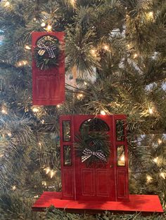 two red doors on top of a christmas tree