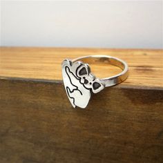 Koala Sterling Silver Charm RingAn adorable koala hugs a heart on this charming ring. Silver charm is soldered to a 1/8" wide sterling silver band in whole sizes 5-9.Your ring will be made to order, so please give me 1-5 business days to make it. Each item comes in a cute box ready for gift giving, without a receipt. If you'd like to include a gift message, let me know at checkout. Items are shipped USPS First Class. Shipping upgrades available at checkout. Jennifer Reed, Modern Store, Dog Ring, Animal Ring, Charm Ring, Dog Pendant, Dog Necklace, Animal Rings, Cute Box