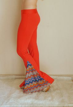 "Burnt orange boho chevron women bell bottoms Burnt organge and chevron print boho hippe style adorable stretchy so comfortable women bell bottoms. You can wear this awesome women leggings for the Festival,Activity,Party and school.Also you can wear to go to Clubs and yoga.. If you would like to feel the 70s clothing style this stretchy unique bell bottoms is just for you. Choose your size.This black bell bottoms made by stretchy jersey and avaliable plus size XXL.. SIZE CHART; Extra Small (US 0 Bohemian Stretch Flares, Bohemian Stretch Flare Bottoms, Bohemian Flare Stretch Bottoms, Bohemian Spring Bottoms With Flared Hem, Fitted Bohemian Flares For Spring, Orange Wide Leg Festival Pants, Orange Wide Leg Pants For Festival, Orange Stretch Bottoms For Festival, Orange Hippie Bottoms For Spring