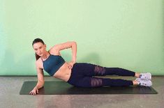 a woman is doing an exercise on a mat