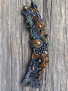 a beaded bracelet on top of a wooden table