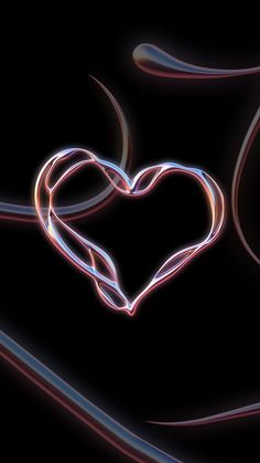 a heart shaped object is shown in the middle of a black background with light streaks