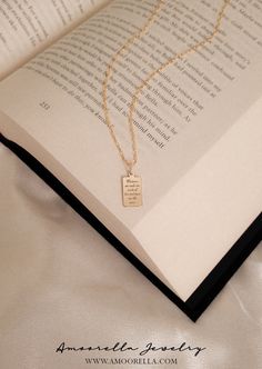 "Custom Book Quote Pendant or Necklace ✦ 𝐈𝐓𝐄𝐌 𝐃𝐄𝐓𝐀𝐈𝐋𝐒 ✦ ▪ Sterling Silver or 14k Gold Filled ▪ Pendant Finish: Shiny/Polished ▪ Pendant Sizes Available:  HARPER (#3): 14.5mm x 9mm HARPER (#4): 18mm x 10.5mm 𝓣𝓱𝓮 𝓢𝓽𝓸𝓻𝔂𝓫𝓸𝓸𝓴 𝓒𝓸𝓵𝓵𝓮𝓬𝓽𝓲𝓸𝓷 Mix & Match our Storybook Chains & Pendants to create your story and wear it close to the heart. 𝘛𝘩𝘪𝘴 𝘱𝘦𝘯𝘥𝘢𝘯𝘵 𝘪𝘴 𝘢 𝘱𝘢𝘳𝘵 𝘰𝘧 𝘈𝘮𝘰𝘰𝘳𝘦𝘭𝘭𝘢'𝘴 𝘚𝘵𝘰𝘳𝘺𝘣𝘰𝘰𝘬 𝘊𝘰𝘭𝘭𝘦𝘤𝘵𝘪𝘰𝘯 𝘢𝘯𝘥 𝘸𝘪𝘭𝘭 \"𝘚𝘭𝘪𝘥𝘦 ? Inspirational Rectangular Jewelry For Gifts, Personalized Bookish Necklace For Gift, Rectangular 14k Gold Filled Jewelry As A Gift, Rectangular 14k Gold Filled Jewelry Gift, Rectangular 14k Gold Filled Jewelry For Gifts, Inspirational Personalized Rectangular Jewelry, Engraved Rectangular Jewelry For Best Friend, Inspirational Handmade Gold Necklaces, Spiritual Gold Jewelry For Best Friend Gift