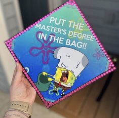 someone holding up a spongebob book with the title put the master's degree in the bag