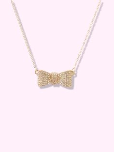 Rhinestone Bow Necklace | Sassy Shortcake Chic Bling Jewelry For Gifts, Chic Crystal Necklace For Gift, Chic Formal Necklace With Rhinestones, Chic Gold Rhinestone Necklace For Gift, Chic Cubic Zirconia Necklace For Gifts, Chic Bow Necklace For Gift, Elegant Party Necklace With Bow, Elegant Bow Necklace For Party, Adjustable Bow Tie Jewelry For Party