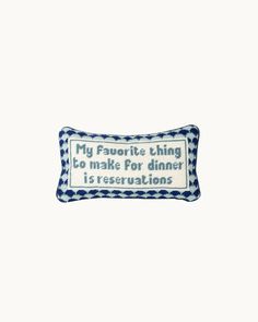 a blue and white pillow that says, my favorite thing to make for dinner is reservations