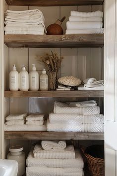 the shelves are filled with white towels and other items