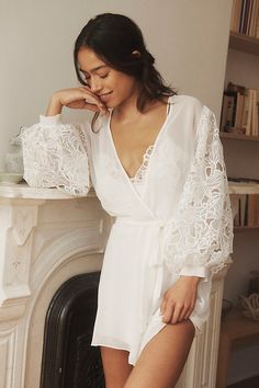 Wrap yourself in the ethereal embrace of the Rya Collection Milos Cover-Up Robe, where delicate lace whispers secrets of summer nights. | Milos Lace-Sleeve Cover-Up Robe by Rya Collection in White, Women's, Size: Medium/Large, Polyester at Anthropologie White Boho Robe, Wedding Robe Getting Ready Lace, White Fancy Robe, Beautiful Bridal Robes, Break Up Robe, Lace Robe With Train, Night Robe Lace, Lace Bridal Robe Long, Bridal Getting Ready Loungewear