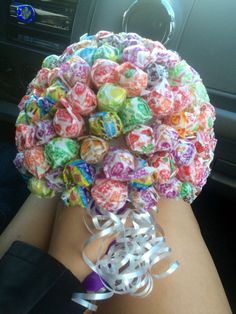 a bouquet made out of buttons sitting in the back seat of a car