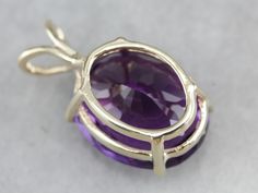 This amethyst gem is bursting with brilliant purple color! The oval cut faceting optimizes its luster, and the yellow gold only compliments the stone with its warm hue. This pendant could be worn everyday or for special occasions! This pendant does not come with the chain shown. Please feel free to contact us, we will help you find the perfect chain for your style and budget! Metal: 14K Yellow Gold Gem: Amethyst 14.00 Carats Gem Measurements: 17.7 x 14.5 mm, Oval Measurements: 26 x 15 mm, with b Faceted Oval Purple Jewelry, Oval Amethyst Ring With Diamond Cut, Oval Diamond Cut Amethyst Ring, Oval Purple Diamond Cut Jewelry, Purple Oval Diamond Cut Jewelry, Oval Amethyst Gemstones With Prong Setting, Purple Oval 14k Gold Gemstone, Polished Oval Amethyst Jewelry, Oval Amethyst Jewelry With Polished Finish