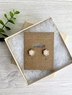 Super simple and sweet everyday beaded stud earrings in white and gold!  Perfect for all occasions!Handwoven hexagon shaped earrings on gold plated post.Earrings measure 1/2” wide.Made from premium miyuki delica beads.Earrings are carefully packaged on earring board and in gift box ready for gifting too! Minimalist White Beaded Earrings As Gift, Minimalist White Beaded Earrings For Gifts, Minimalist Gold Beaded Earrings As Gift, Dainty White Beaded Earrings For Gifts, Minimalist White Beaded Earrings Gift, Minimalist White Beaded Earrings With Tiny Beads, Minimalist White Earrings With Tiny Beads, Small Beaded Stud Earrings, Delica Stud Earrings