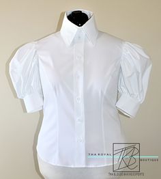 Stun with these gorgeous gathered puffy sleeve button down blouses. Made with 100% stretch poplin. Poplin has a slight stretch with a smooth sateen finish. The blouse features: *Puffy gathered short sleeves *Gathered upper arm cuffs * 2 button cuffs * Front button fastening **If you would like your blouse made to your measurements please submit your normal bra & cup size, bust, waist, hip, and upper arm width measurements in the notes section when placing your order.** Don't see a color you Puffy Sleeve Shirt, Manset Lengan, Puffy Shirt, Upper Arm Cuffs, Blouse Designer, Arm Cuffs, Ladies Blouse Designs, Bra Cup, Bra Cup Sizes