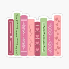 a row of books with hearts and leaves on them sticker is shown in pink, green